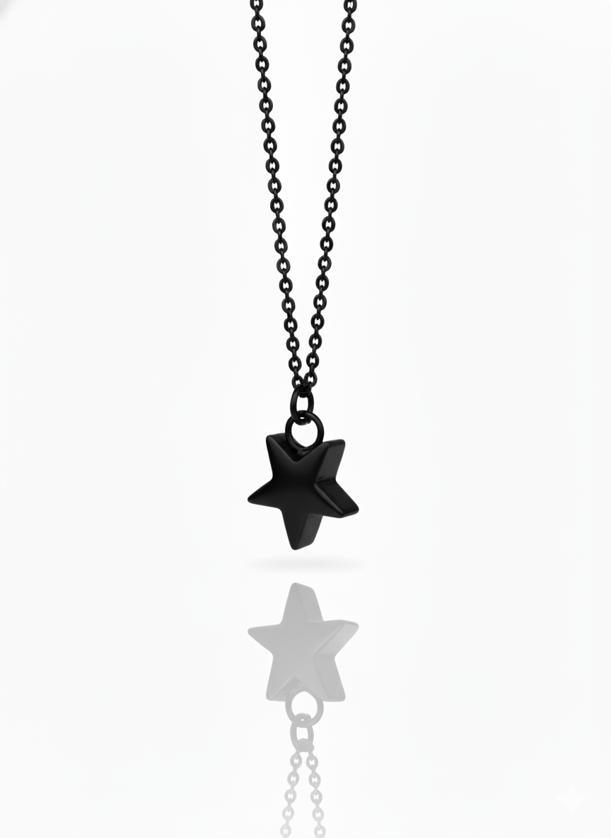 Black star-shaped pendant on a chain against a white background