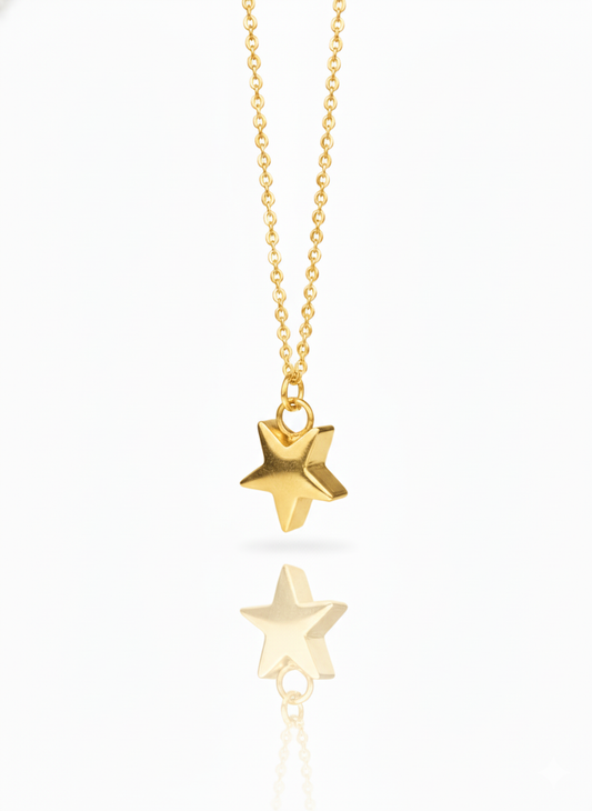 Gold star-shaped pendant necklace on a white background