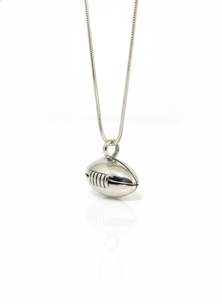 Silver football-shaped pendant on a chain against a white background