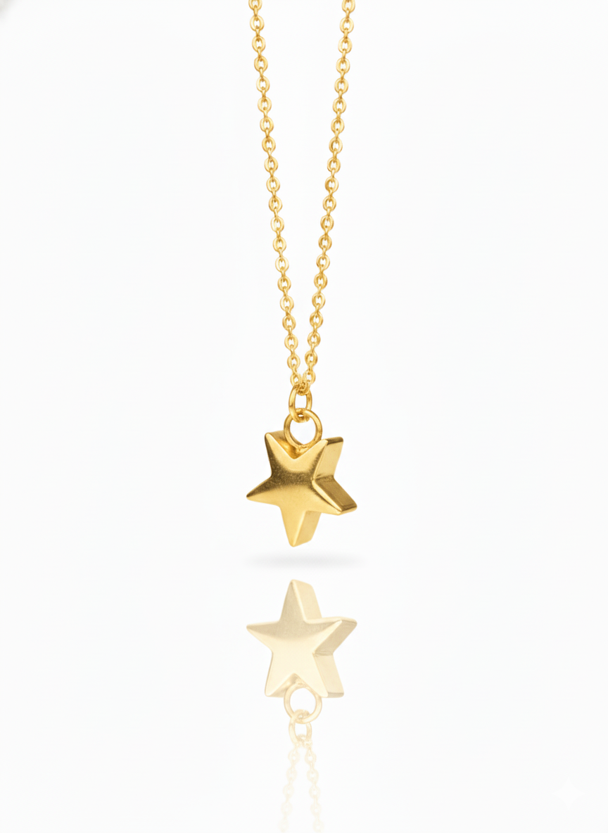 Gold star-shaped pendant necklace on a white background